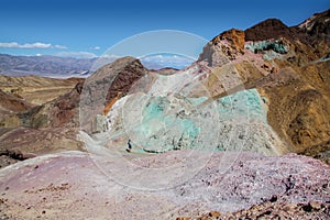 View of the green, blue and purple rocks of ArtistÃ¢â¬â¢s Palette in Death Valley National Park photo
